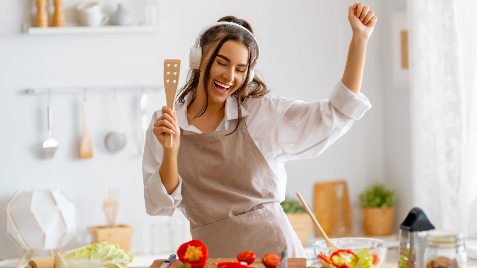 Cooking Woman Meal Prep Healthy Singing Yuganov Konstantin Shutterstock