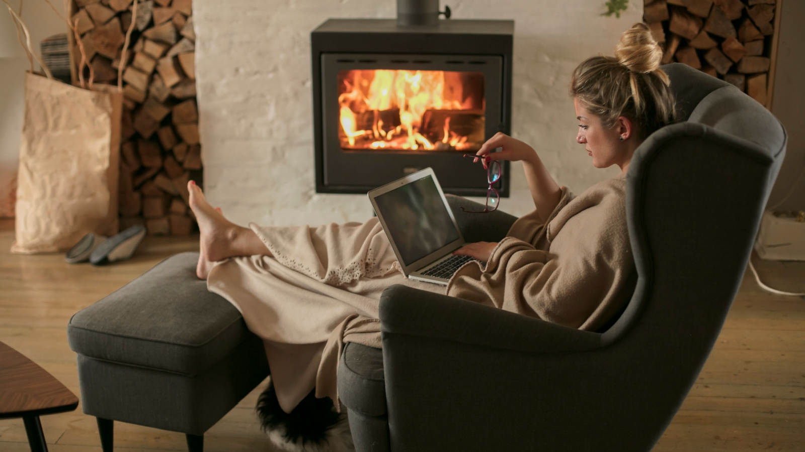 Woman Cozy Winter Warm Fire Cozy Working Reading Nikodash Shutterstock